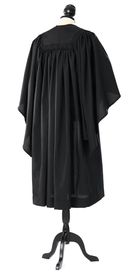 Cambridge bachelor's gown in black, back view with gathered shoulders