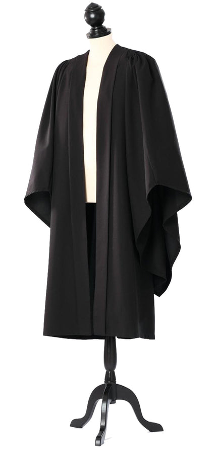 Oxford bachelor's gown in black, open front and broad sleeves, on a tailor's mannequin