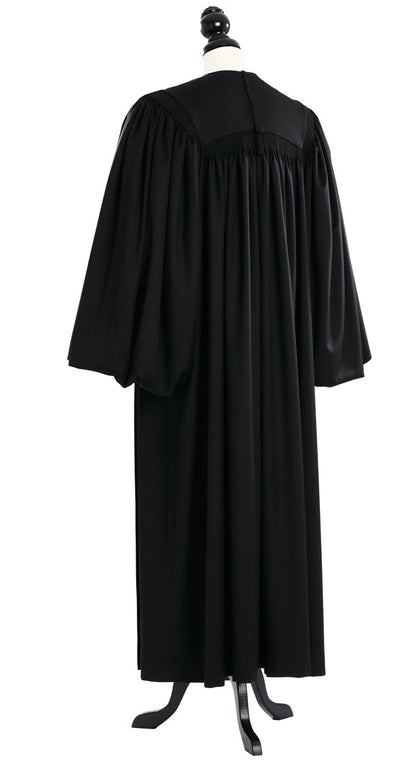Magisterial US Judge Robe in black, back view, gathered yoke, full bloused sleeves, on a tailor mannequin