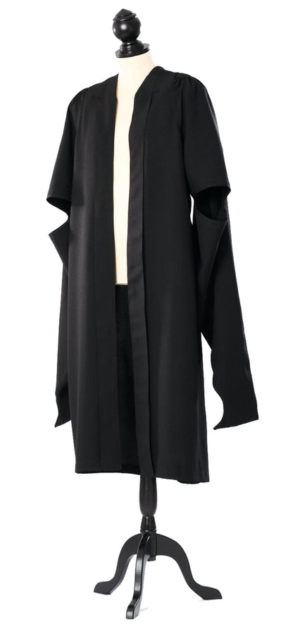 Cambridge master's gown in black, open front and long hanging sleeves with arm openings