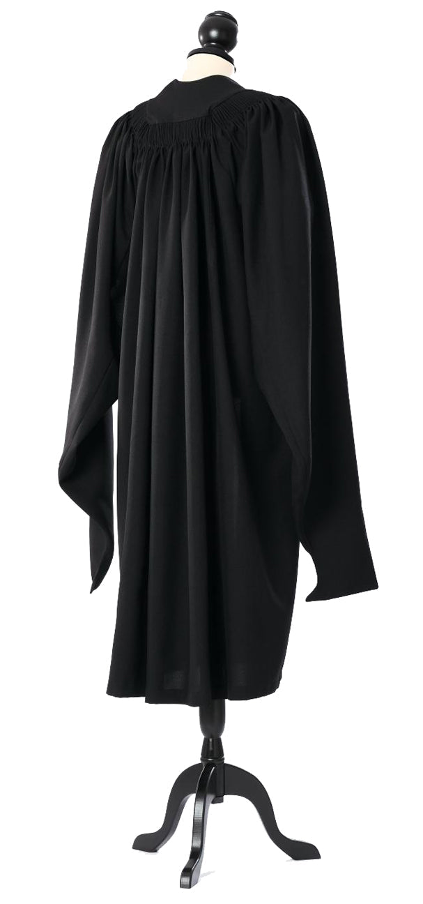 Cambridge master's gown in black, back view with gathered shoulders and hanging sleeves