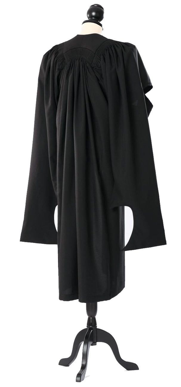 Oxford master's gown in black, back view with gathered shoulders and hanging sleeves