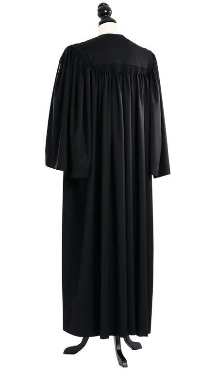 Principal US Judge Robe in black, back view, gathered yoke, medium half-bell sleeves, on a tailor mannequin