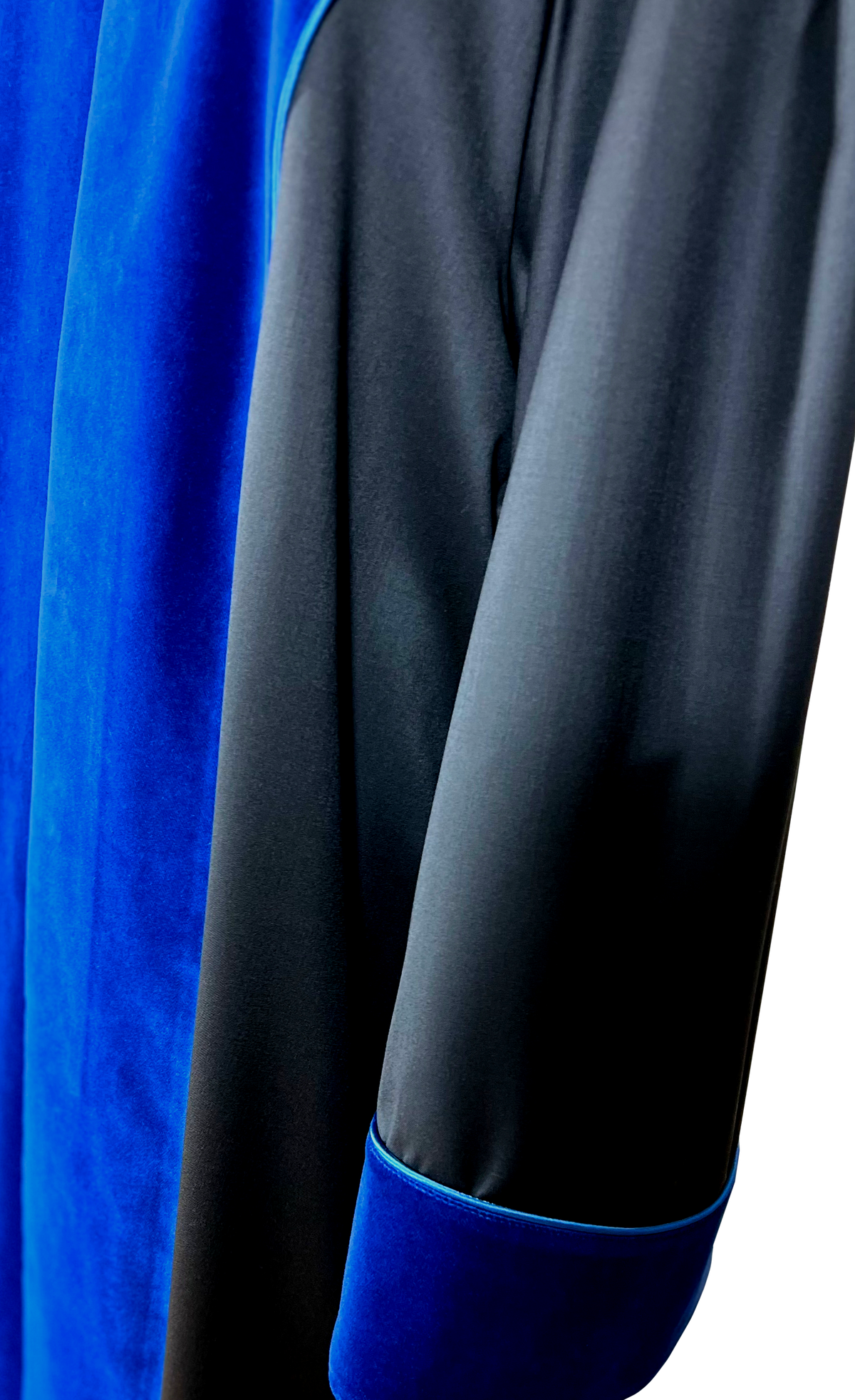 Close-up of the UPC First Instance robe: blue velvet cuff and lapel with blue piping on black cloth