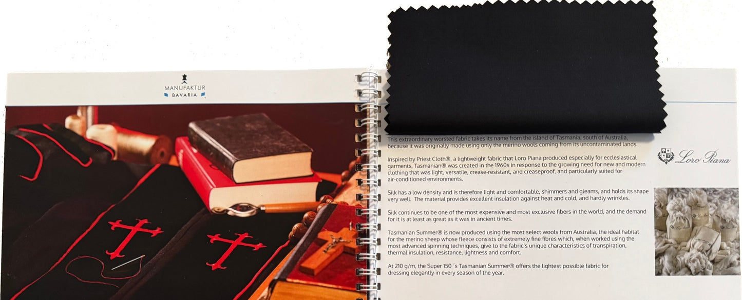 Open fabric swatch card by Manufaktur Bavaria — spiral-bound sample book with Loro Piana cloth swatch