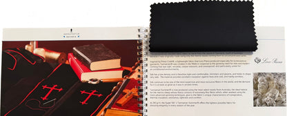 Open fabric swatch card by Manufaktur Bavaria — spiral-bound sample book with Loro Piana cloth swatch