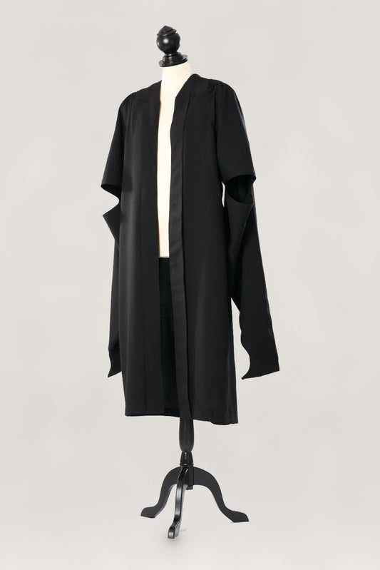 Cambridge master's gown in black, open front and long hanging sleeves with arm openings