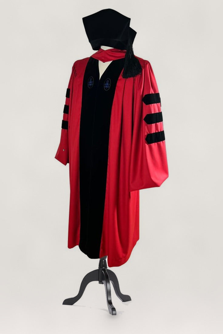 Harvard doctoral robe in crimson with hood and velvet cap, full view