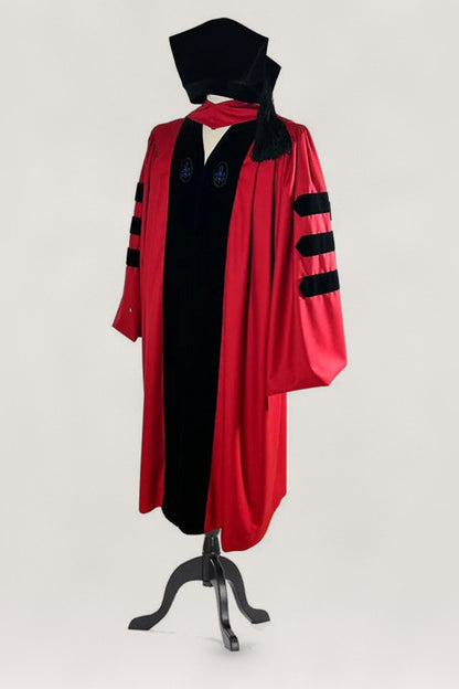 Harvard PhD doctoral robe in crimson with hood and velvet cap — front view