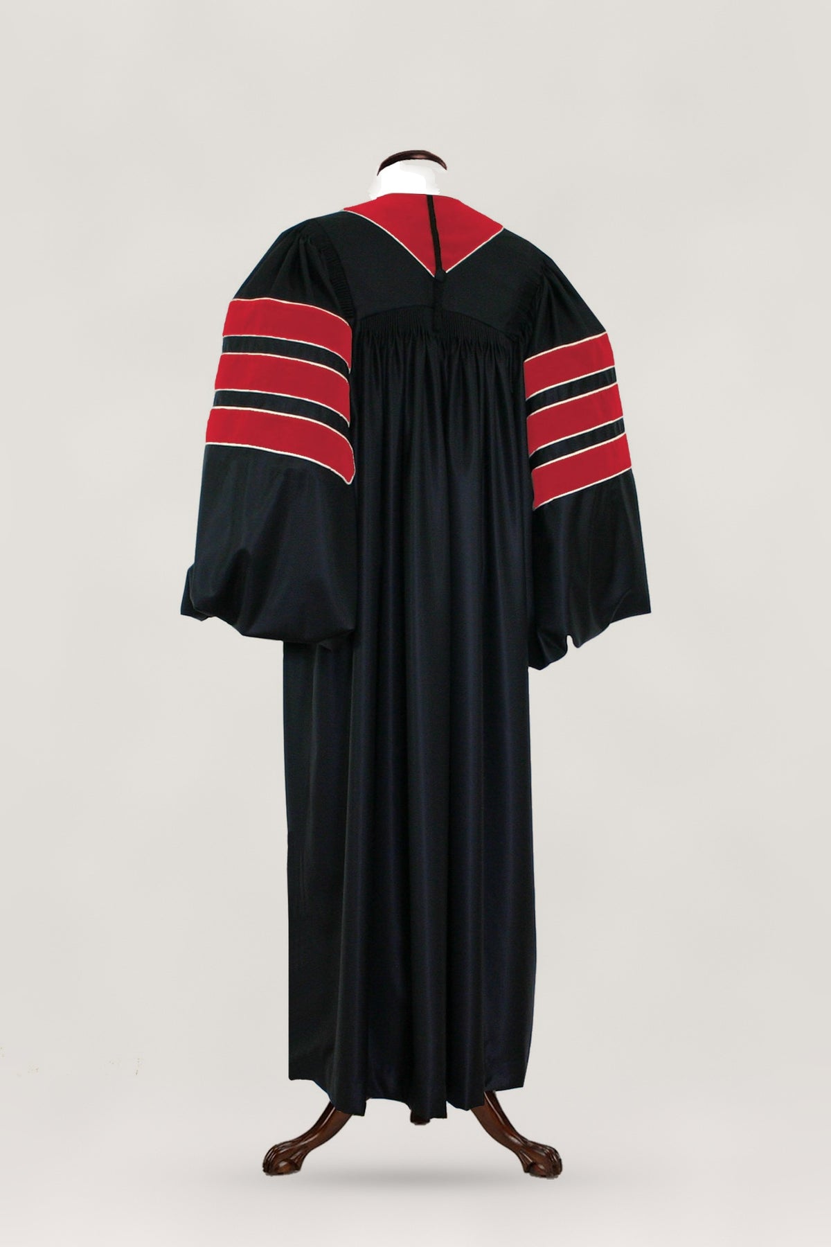 Journalism doctoral gown — back view with crimson velvet trim