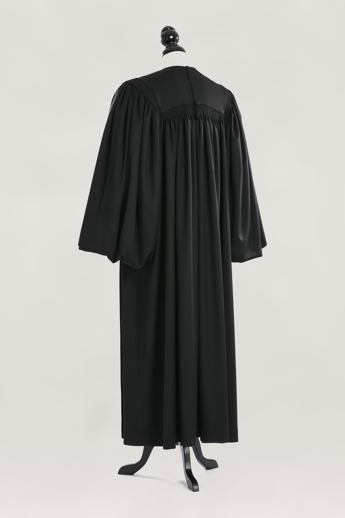 Magisterial US Judge Robe — back view on bust and stand, studio photograph