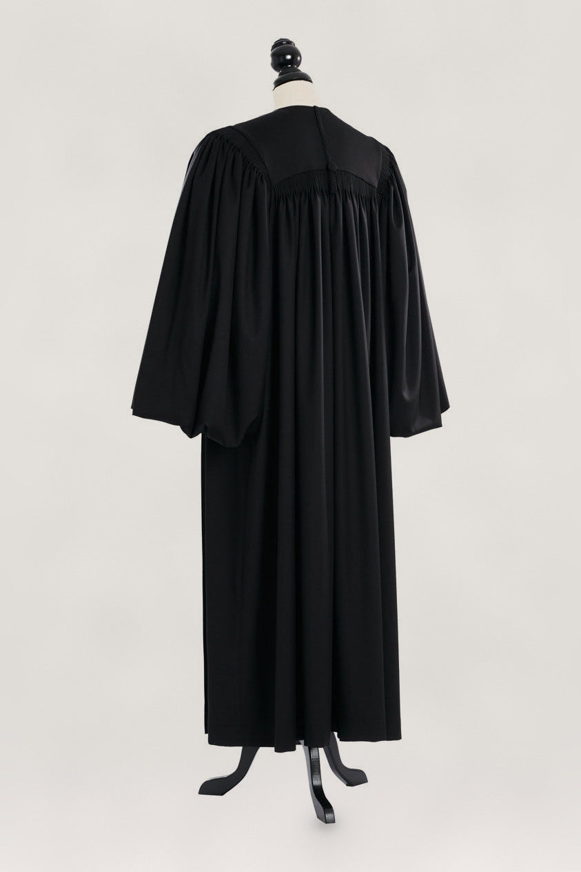 Magisterial US Judge Robe in black, back view, gathered yoke, full bloused sleeves, on a tailor mannequin