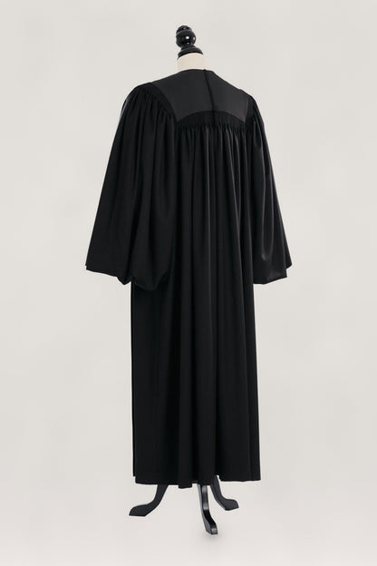 Pontiff US Judge Robe in black, back view, gathered yoke, full bloused balloon sleeves, on a tailor mannequin