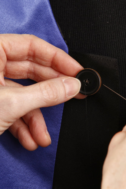 Handcrafted in our atelier: sewing on a button by hand