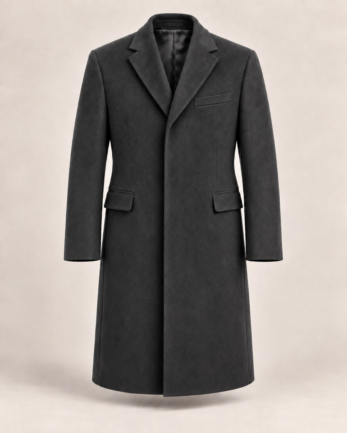Single-breasted Chesterfield in Charcoal with a fly front and flap pockets.